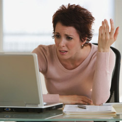 frustrated-woman-using-her-laptop-250-thumb-250x250